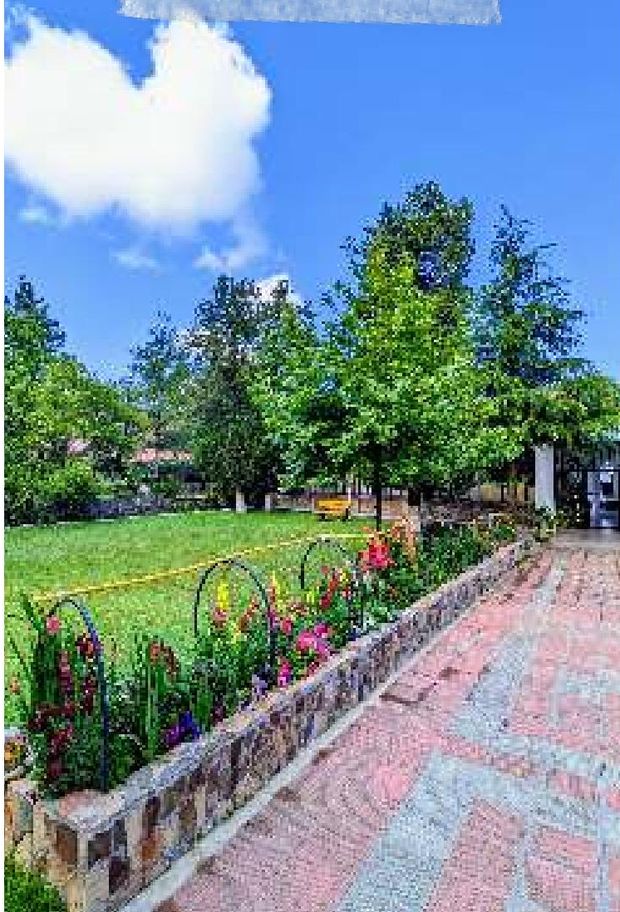 The lawns and brick walkways in high summer. — Lawrence College Ghora Gali
