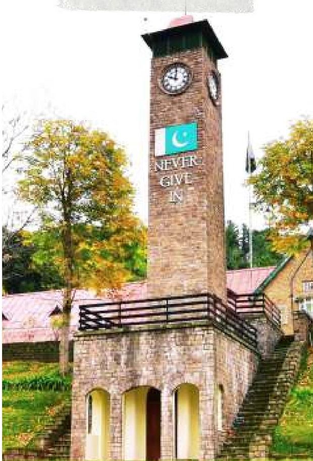 The clock tower and the national flag as autumn turns. — Lawrence College Ghora Gali